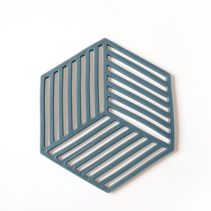 Dessous de Verre Design hexagonal ajouré à motif cube rayé, coloris bleu, présenté sur fond blanc