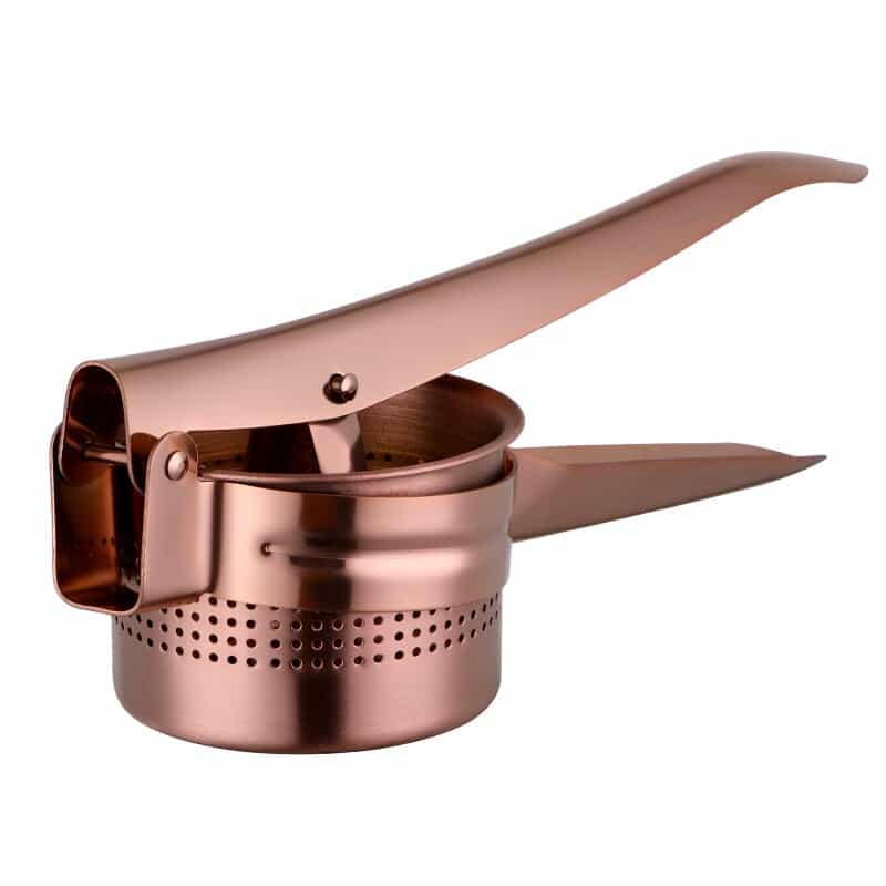 Presse agrume professionnel rose gold à levier et panier perforé métallique sur fond blanc