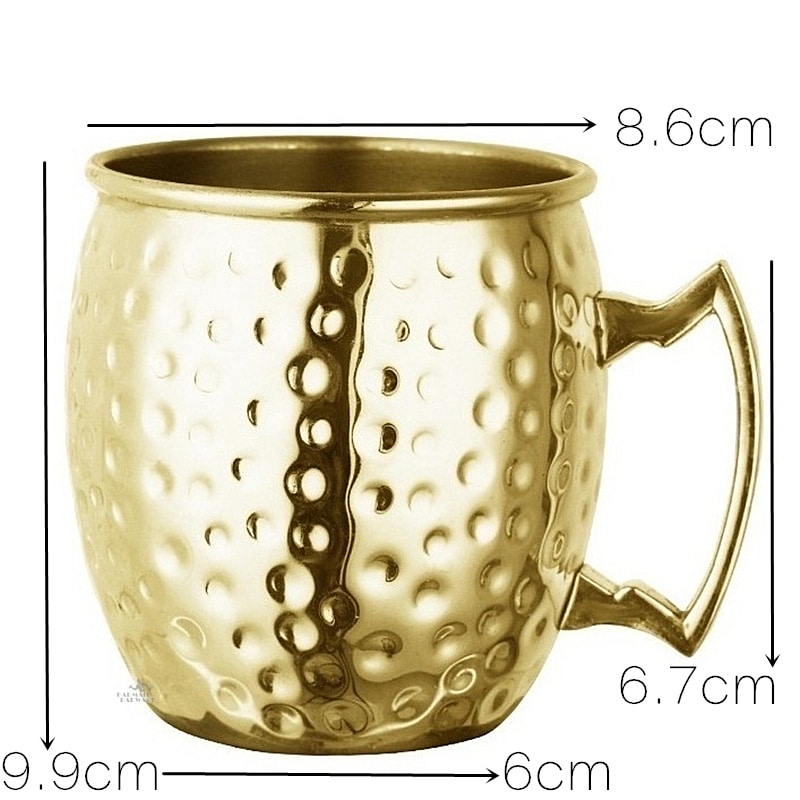 Schéma coté du verre Moscow Mule or : hauteur 9,9 cm, ouverture 8,6 cm, base 6 cm et anse de 6,7 cm